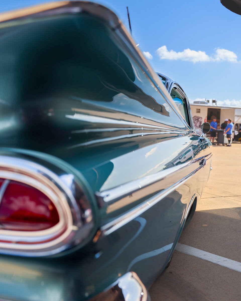 Tail-light detail of a vintage Impala in the cruise area at LS Fest Texas