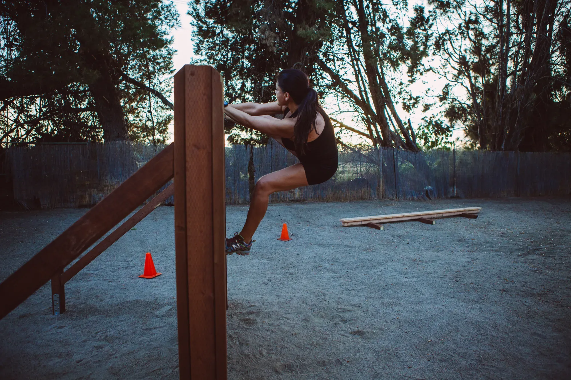 S2 recruit performing an explosive vault drill at dusk